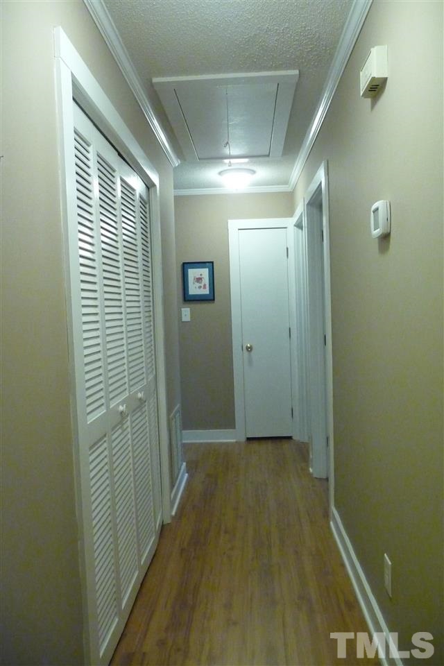8705 Brandon Station Road Raleigh, NC 27613 - Photo 12 of 16 a view of hallway with shower