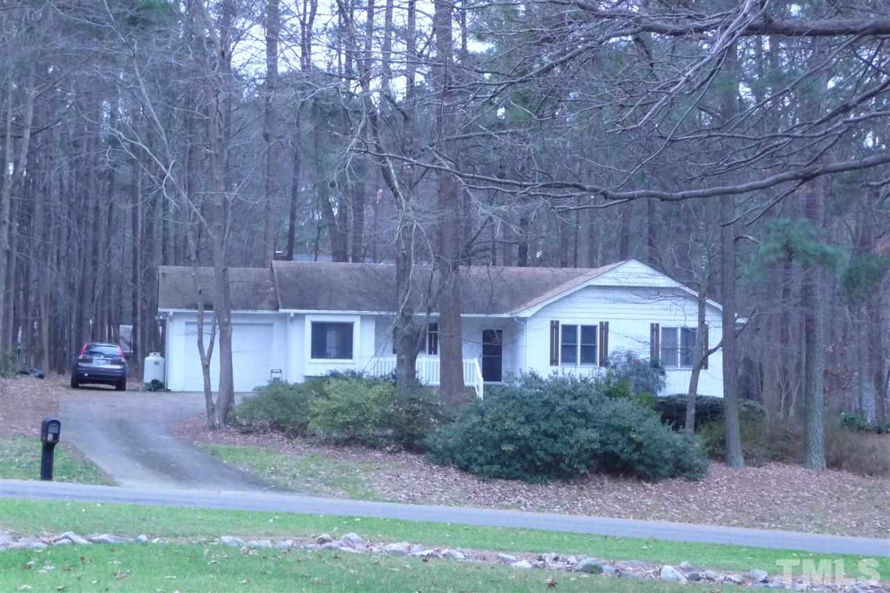 8705 Brandon Station Road Raleigh, NC 27613 - Photo 16 of 16 a front view of a house with garden