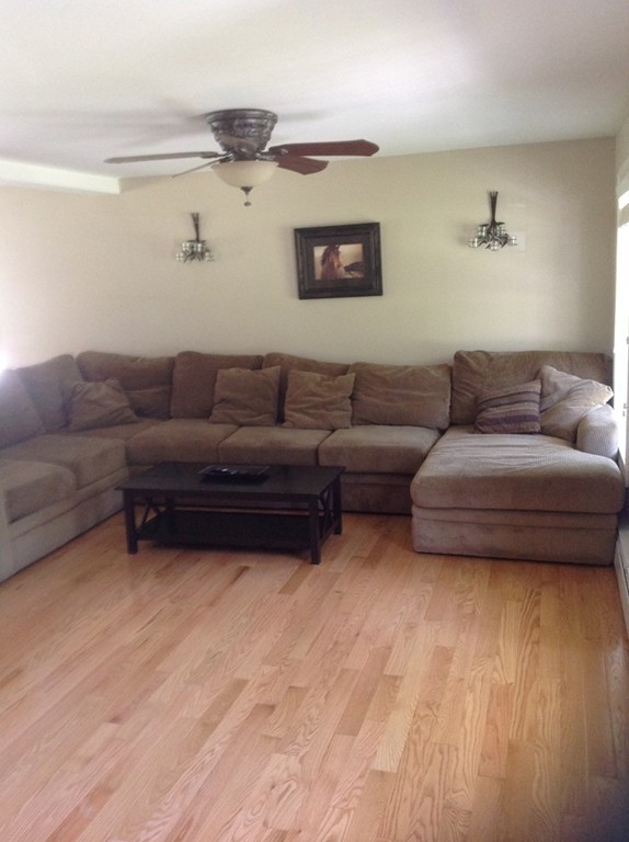 167 Winchendon Road Ashburnham, MA 01430 - Photo 11 of 23 a living room with furniture and a wooden floor