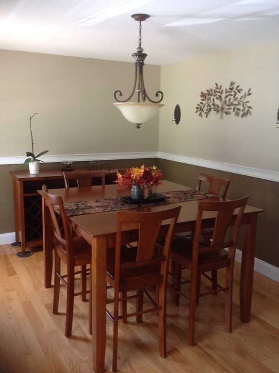 167 Winchendon Road Ashburnham, MA 01430 - Photo 12 of 23 a view of a dining room with furniture and wooden floor