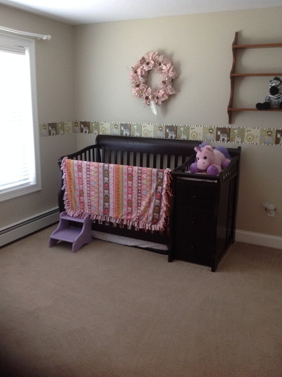 167 Winchendon Road Ashburnham, MA 01430 - Photo 19 of 23 a bed room with a bed and a chair