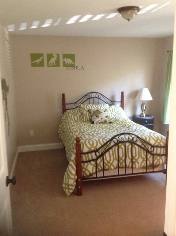 167 Winchendon Road Ashburnham, MA 01430 - Photo 20 of 23 a bedroom with a bed and a table