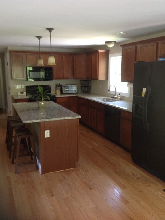 167 Winchendon Road Ashburnham, MA 01430 - Photo 8 of 23 a kitchen with kitchen island granite countertop a sink stainless steel appliances and cabinets
