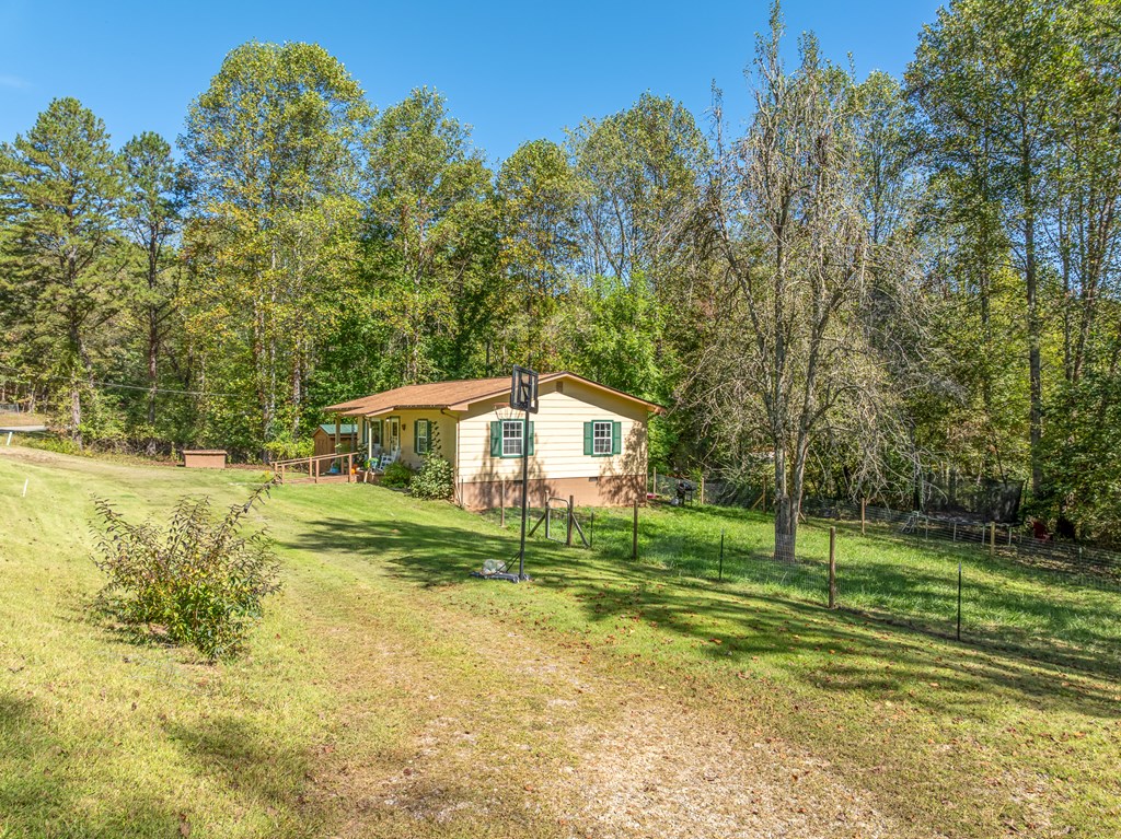 1813 John Smith Road East Blairsville, GA 30512 - Photo 27 of 41 a front view of a house with a yard
