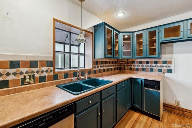 a kitchen with stainless steel appliances granite countertop a stove and a sink