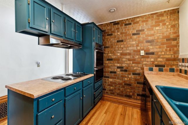 a view of a bedroom with furniture and windows