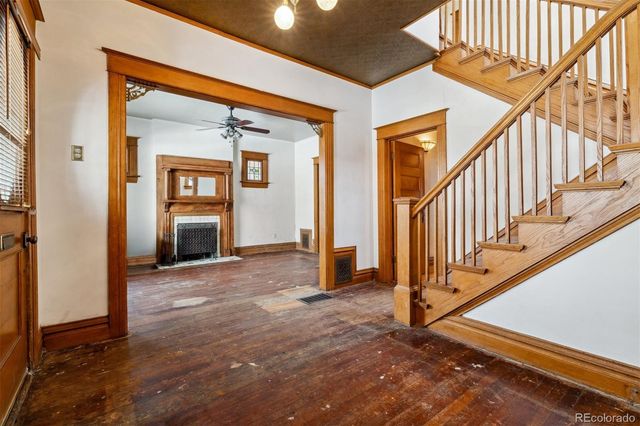 an empty room with windows and closet