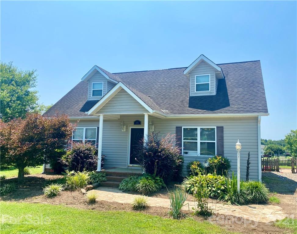 175 Old Airport Road Statesville, NC 28677 - Photo 1 of 15 a front view of a house with a yard and garage