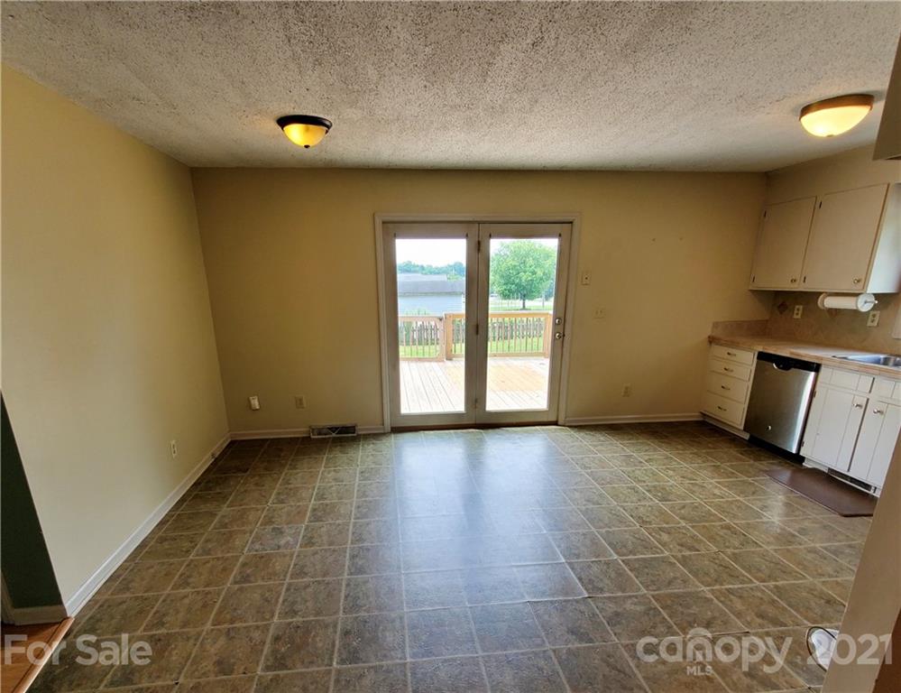 175 Old Airport Road Statesville, NC 28677 - Photo 3 of 15 a view of an empty room with a window