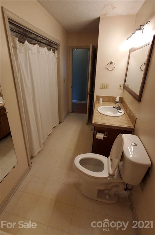175 Old Airport Road Statesville, NC 28677 - Photo 5 of 15 a bathroom with a toilet sink and mirror