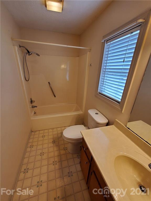 175 Old Airport Road Statesville, NC 28677 - Photo 10 of 15 a bathroom with a sink a toilet and shower