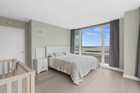 a view of a swimming pool with a lounge chair