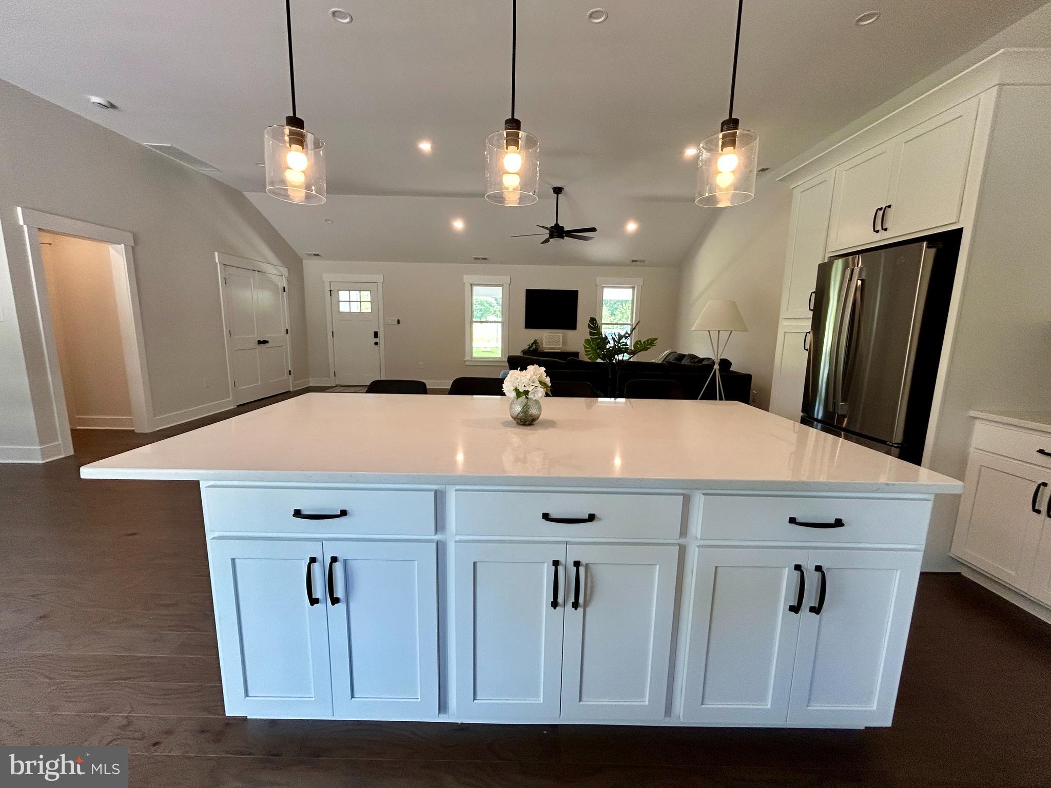 210 Perry Road Woodbine, NJ 08270 - Photo 11 of 35 a view of a kitchen with a refrigerator a sink and a dishwasher