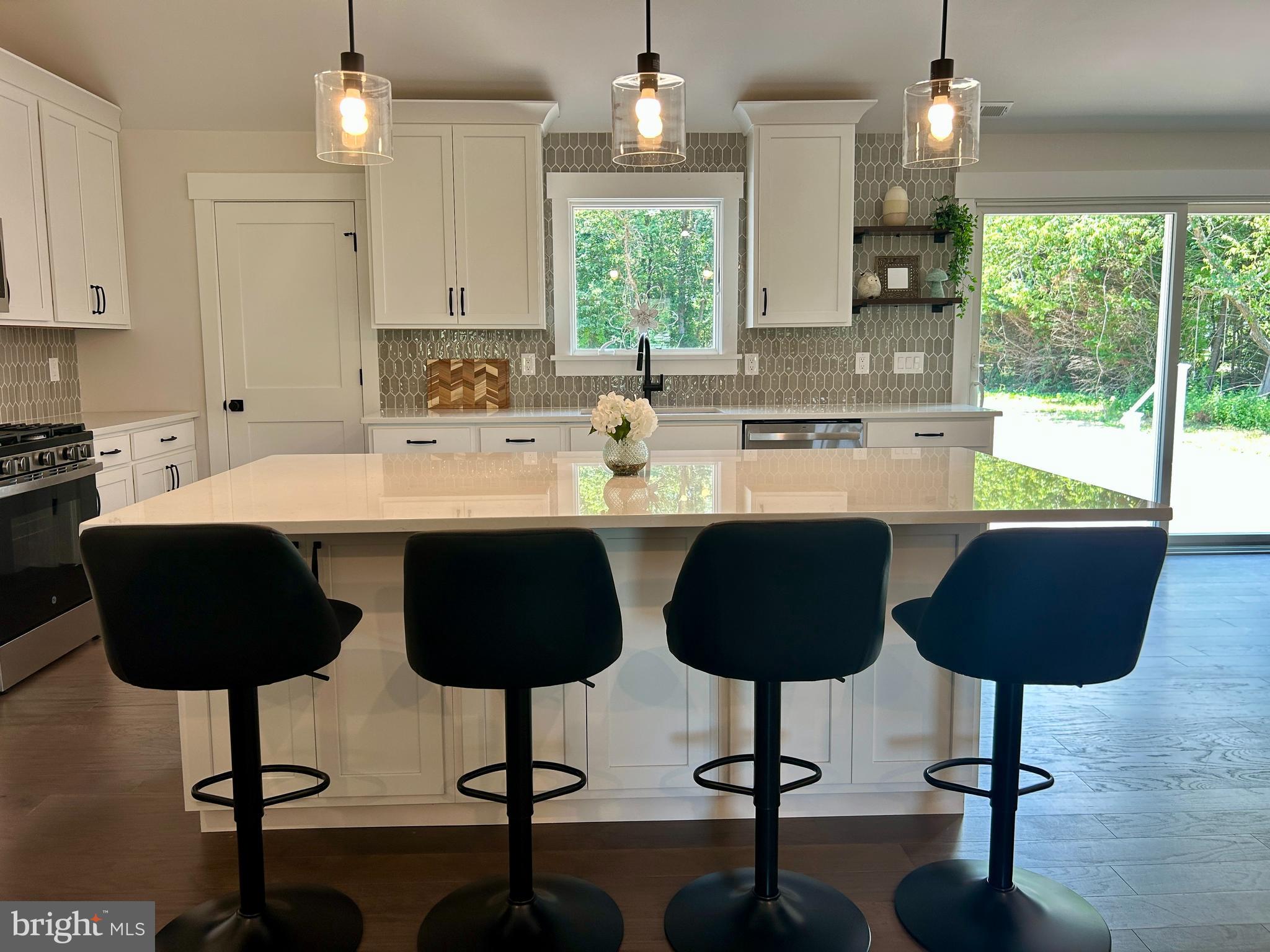 210 Perry Road Woodbine, NJ 08270 - Photo 12 of 35 a kitchen with stainless steel appliances granite countertop a sink counter space and a window