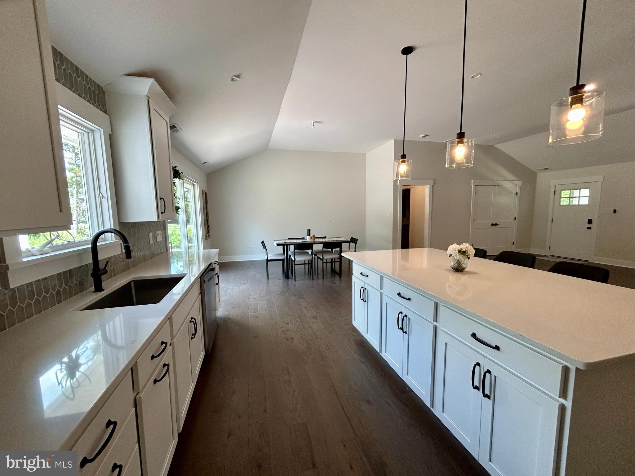 210 Perry Road Woodbine, NJ 08270 - Photo 15 of 35 a large white kitchen with a large center island sink and stove
