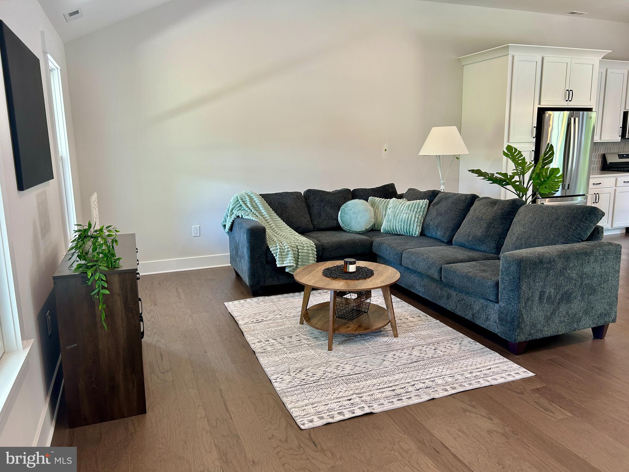 210 Perry Road Woodbine, NJ 08270 - Photo 20 of 35 a living room with furniture and a potted plant