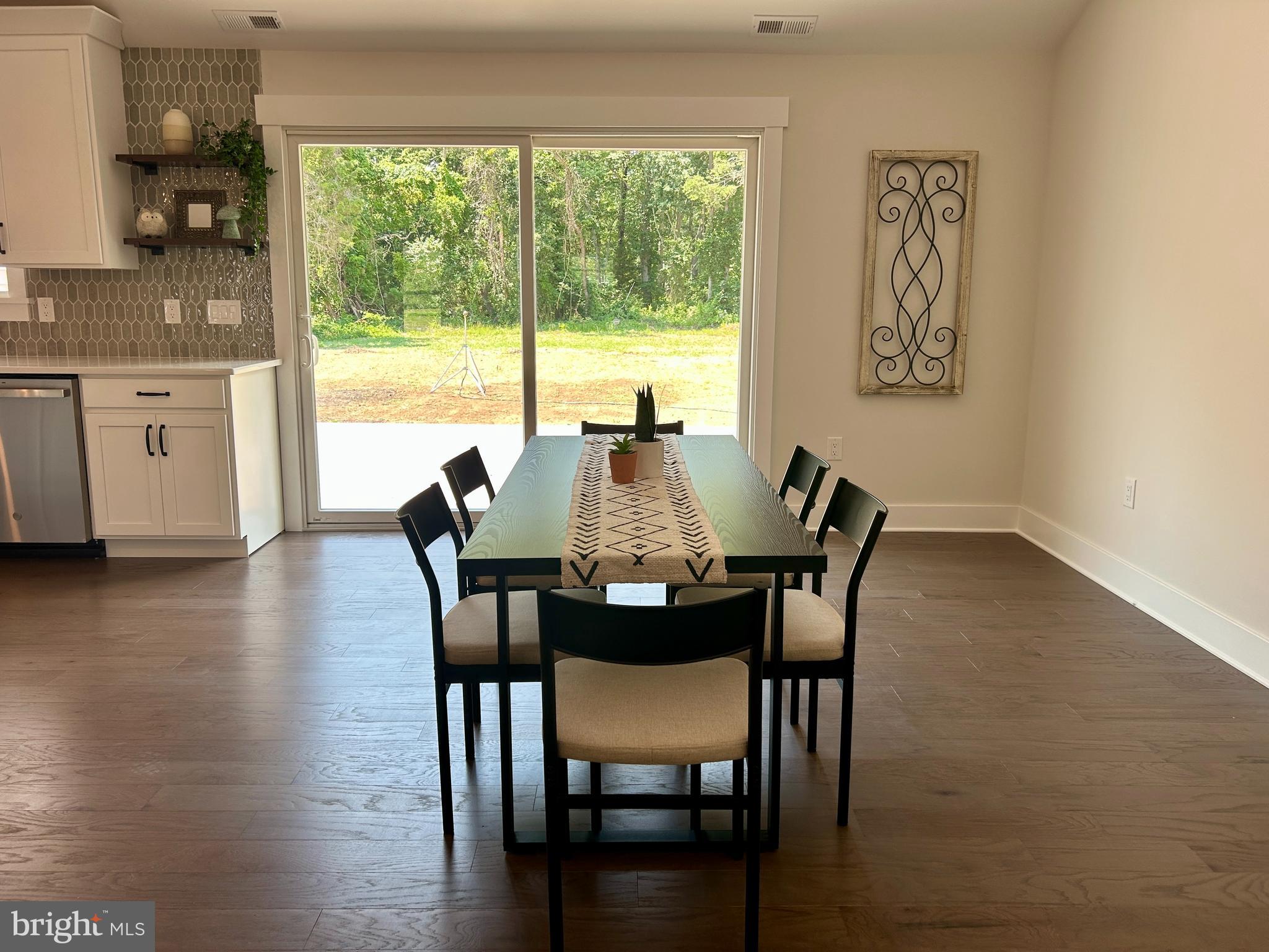 210 Perry Road Woodbine, NJ 08270 - Photo 24 of 35 a view of a dining room with furniture window and wooden floor