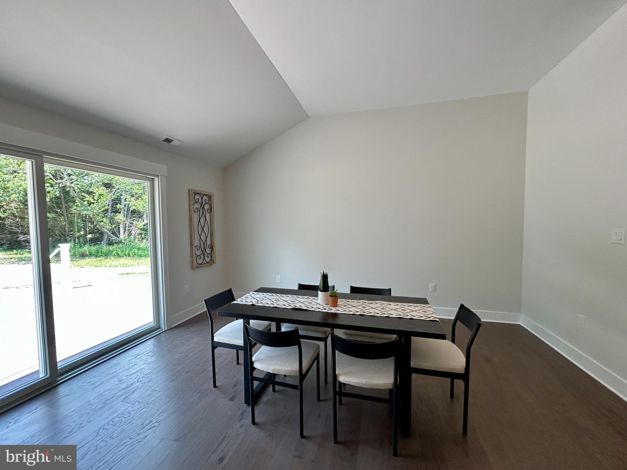 210 Perry Road Woodbine, NJ 08270 - Photo 25 of 35 a view of a dining room with furniture and wooden floor