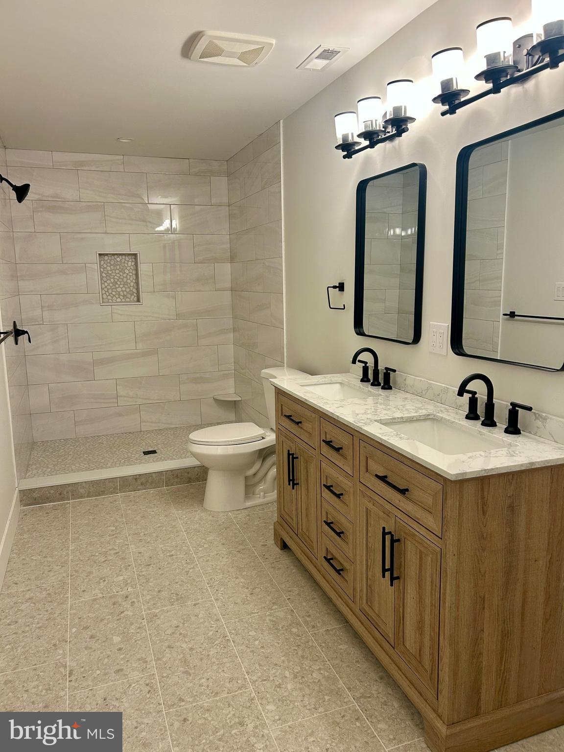 210 Perry Road Woodbine, NJ 08270 - Photo 28 of 35 a bathroom with a double vanity sink mirror and toilet
