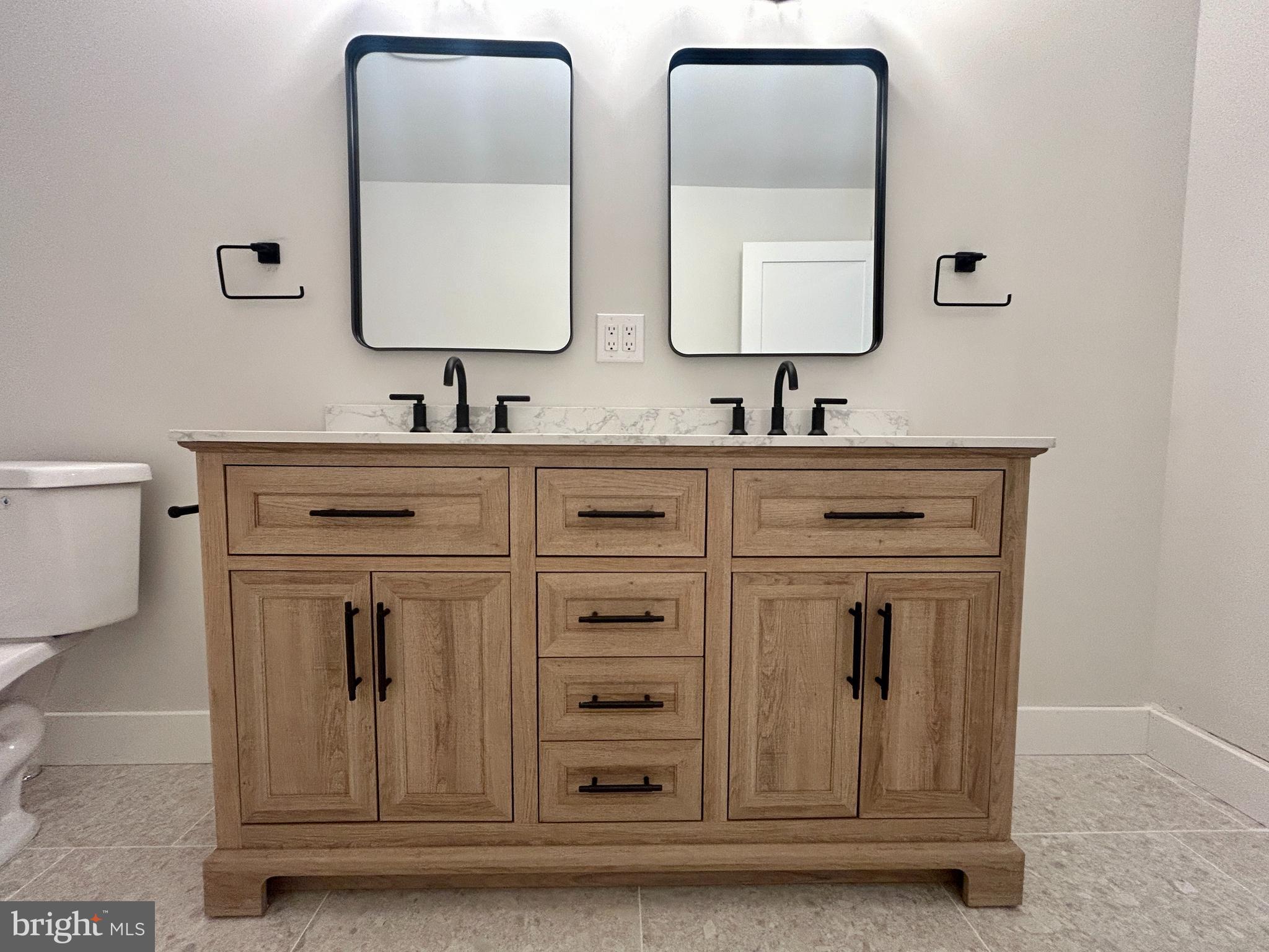 210 Perry Road Woodbine, NJ 08270 - Photo 29 of 35 a bathroom with mirror a sink and a toilet