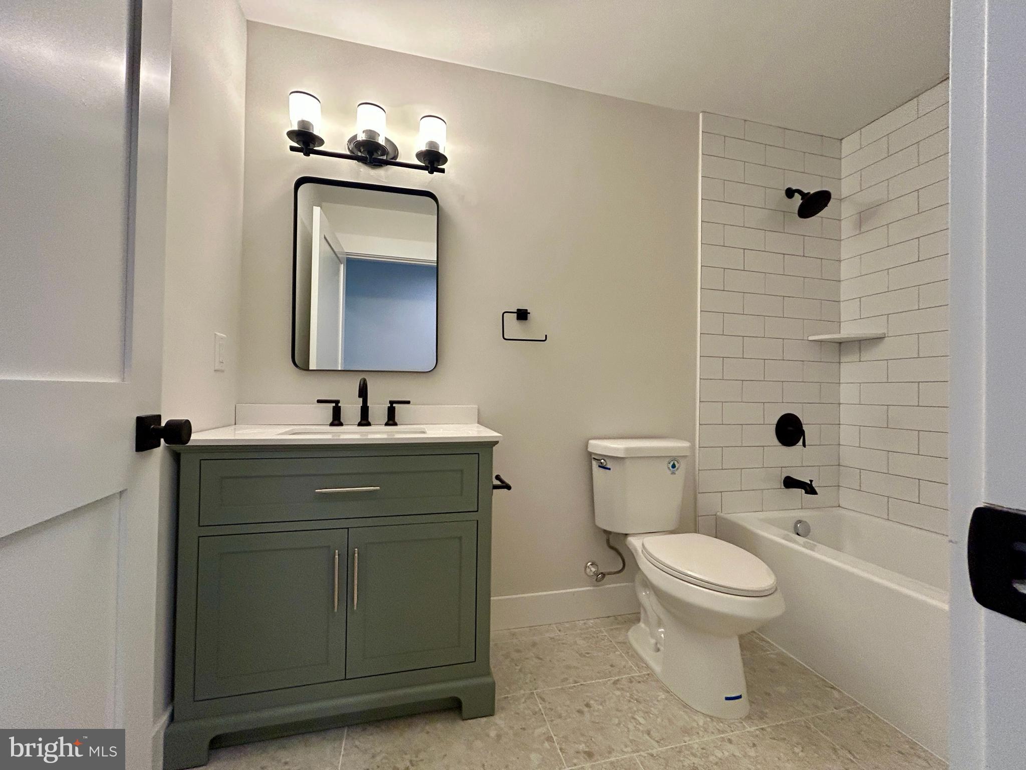 210 Perry Road Woodbine, NJ 08270 - Photo 32 of 35 a bathroom with a toilet sink and mirror