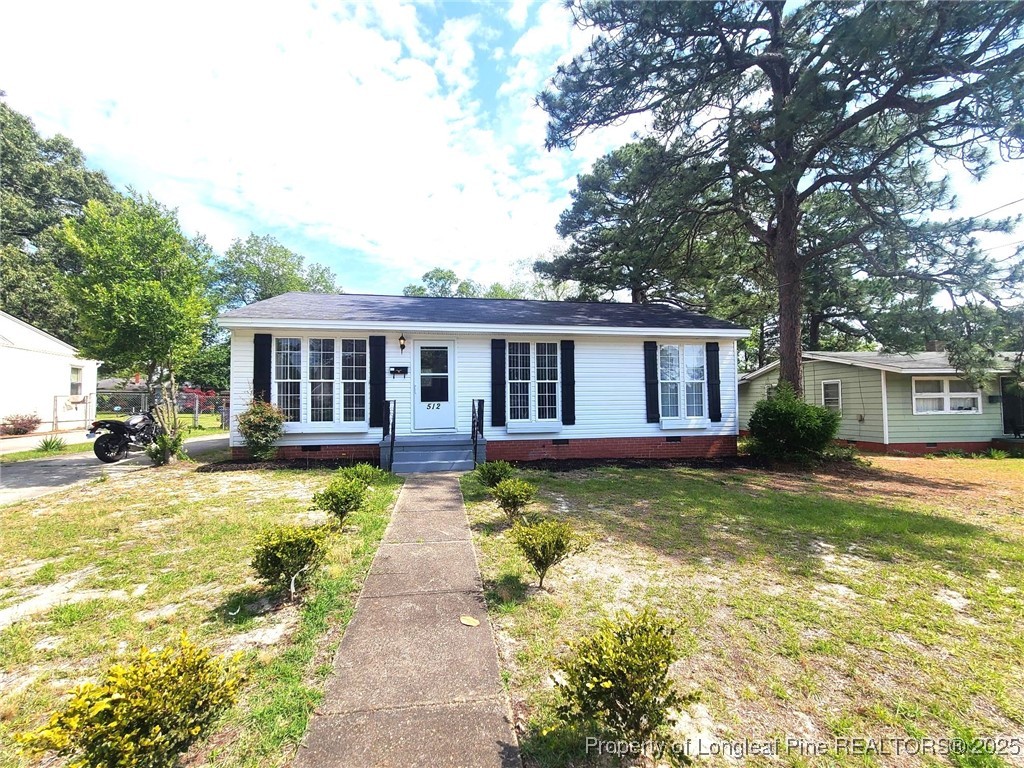 512 Spaulding Street Fayetteville, NC 28301 - Photo 2 of 19 a view of a house with a swimming pool