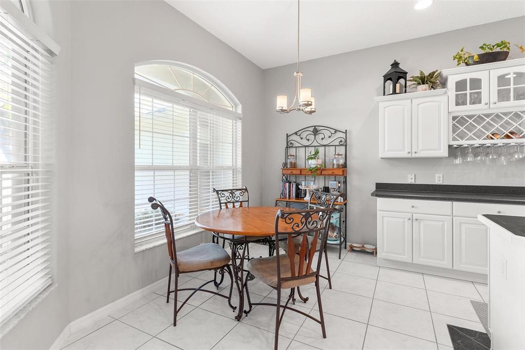 1027 Urico Road Lady Lake, FL 32159 - Photo 18 of 49 a dining room with furniture and window