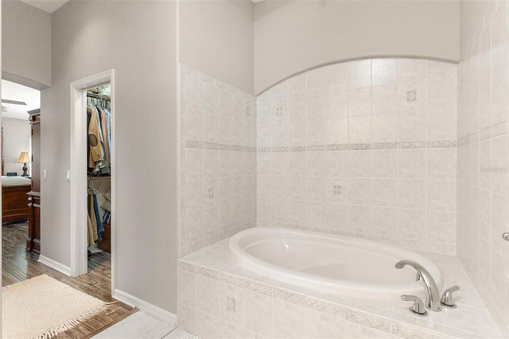1027 Urico Road Lady Lake, FL 32159 - Photo 24 of 49 a bathroom with a bathtub