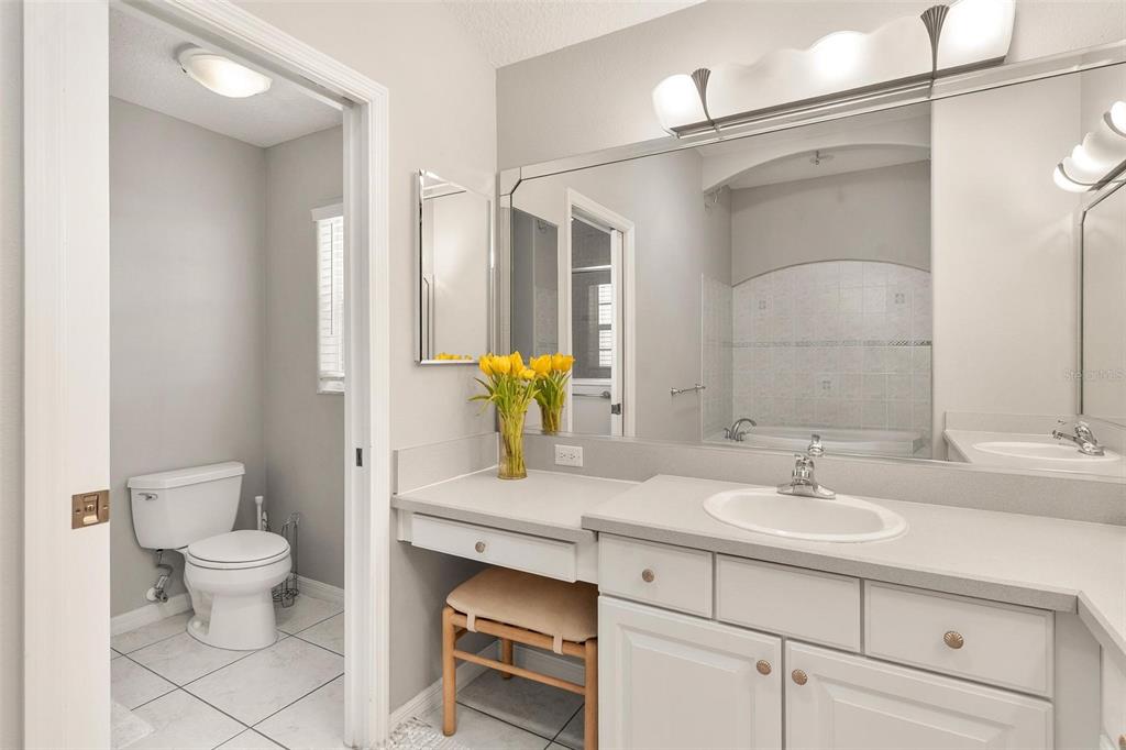 1027 Urico Road Lady Lake, FL 32159 - Photo 25 of 49 a bathroom with a sink toilet and shower