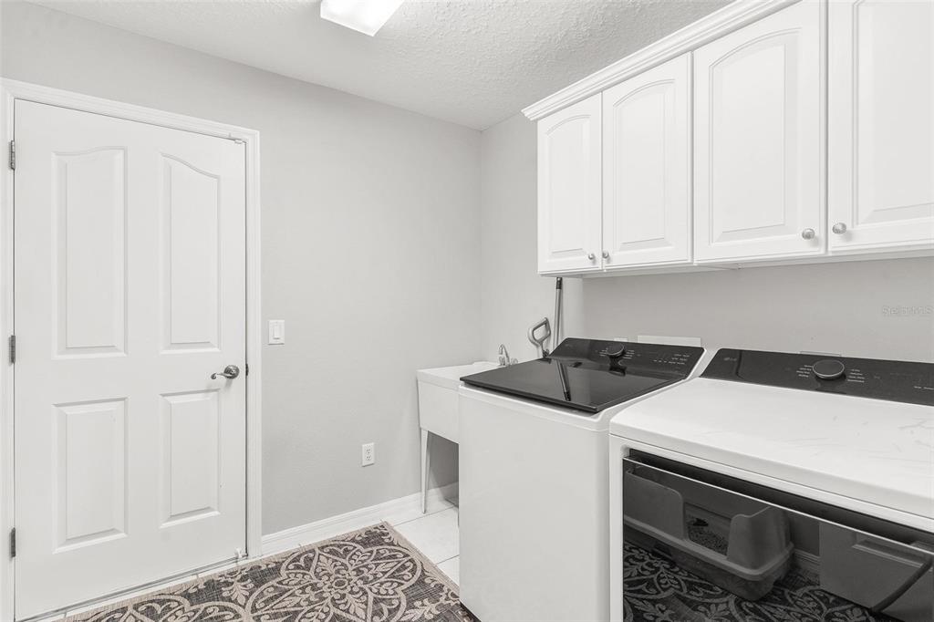 1027 Urico Road Lady Lake, FL 32159 - Photo 32 of 49 a utility room with dryer and washer