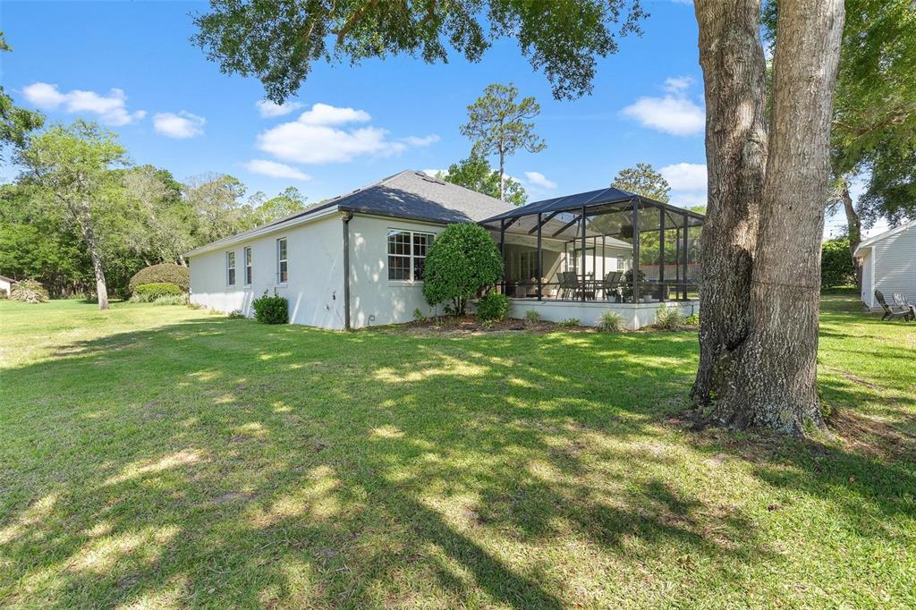 1027 Urico Road Lady Lake, FL 32159 - Photo 38 of 49 a front view of a house with garden