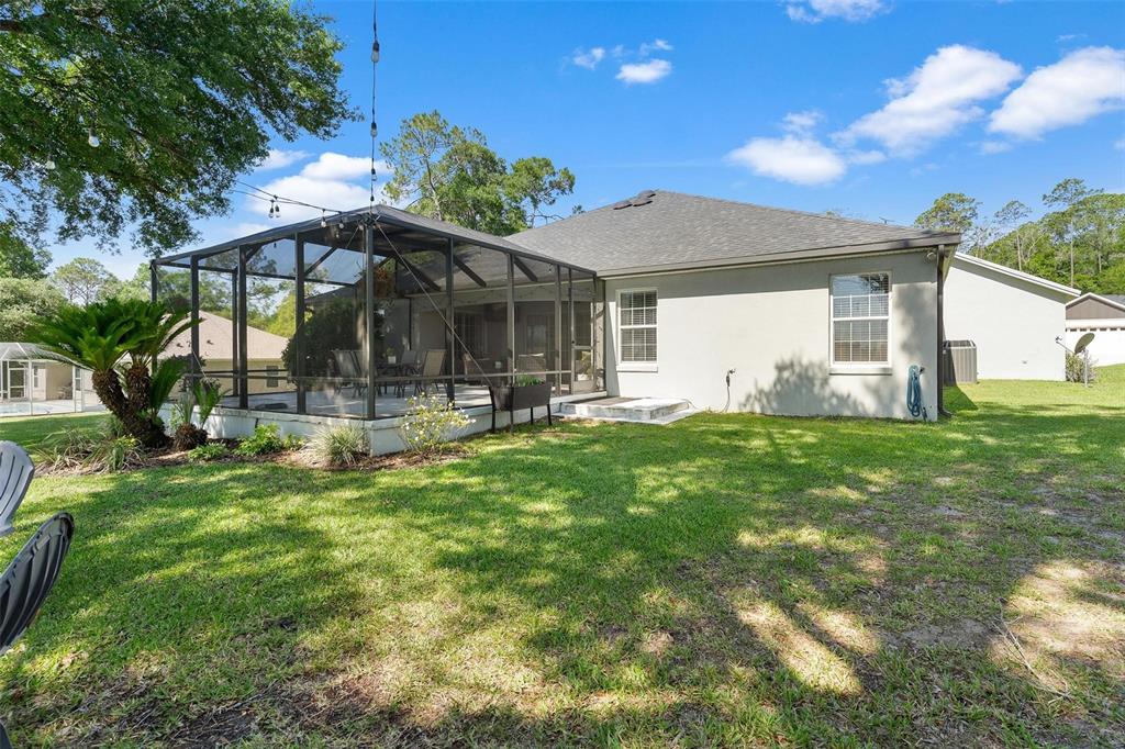 1027 Urico Road Lady Lake, FL 32159 - Photo 39 of 49 a front view of house with yard and outdoor seating