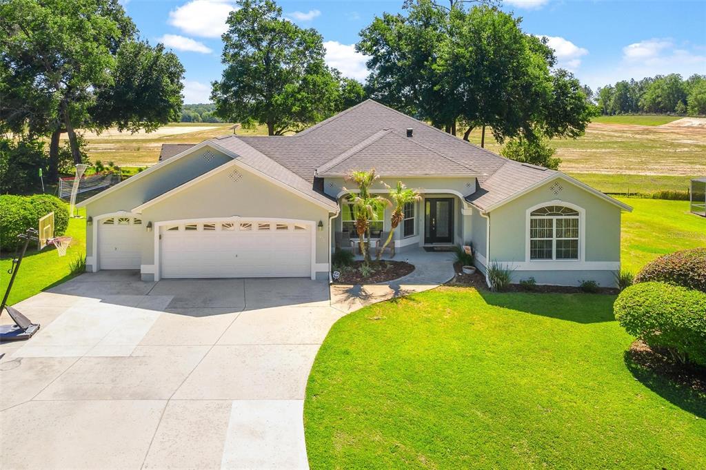 1027 Urico Road Lady Lake, FL 32159 - Photo 44 of 49 a front view of a house with swimming pool
