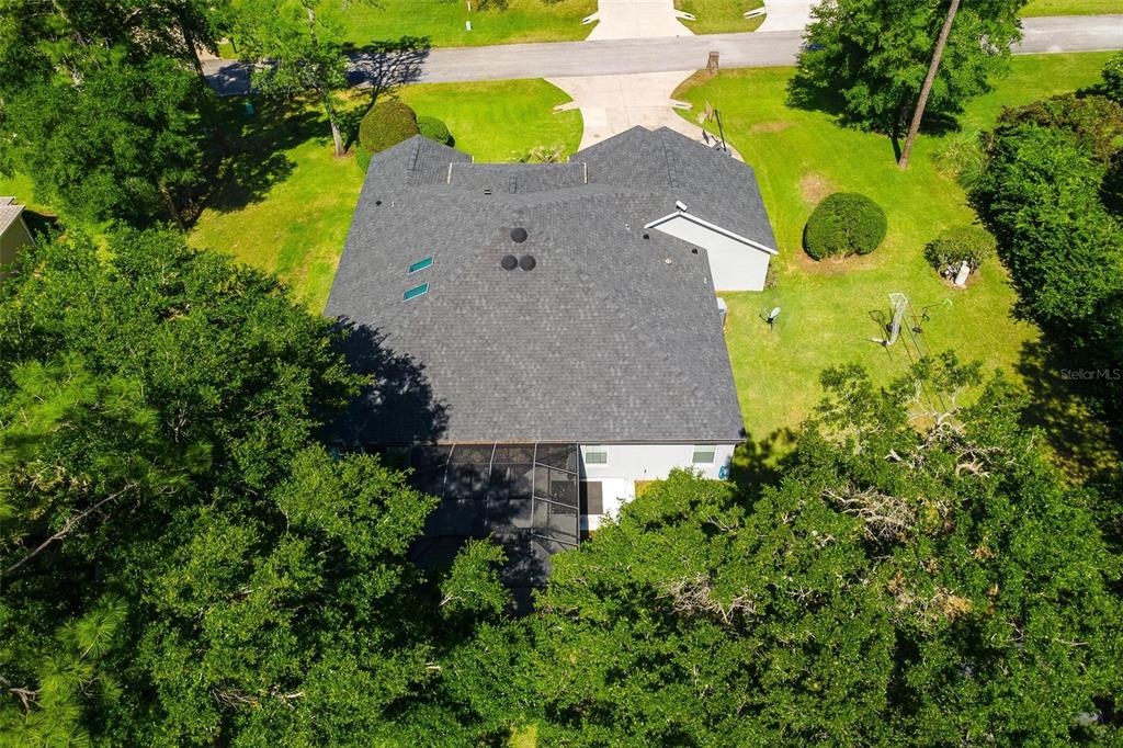 1027 Urico Road Lady Lake, FL 32159 - Photo 48 of 49 an aerial view of a house with a swimming pool and garden view