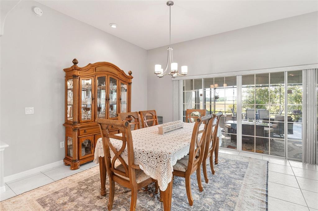 1027 Urico Road Lady Lake, FL 32159 - Photo 10 of 49 a view of a dining room with furniture window and outside view