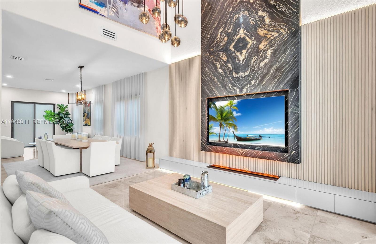 3586 Southwest 143rd Avenue Miramar, FL 33027 - Photo 15 of 51 a living room with furniture and a flat screen tv