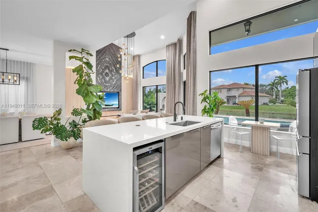a kitchen with a sink stove and cabinets