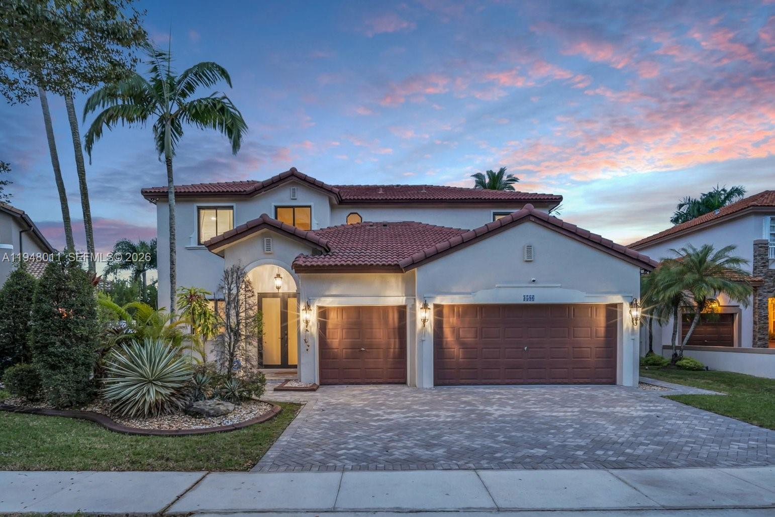 3586 Southwest 143rd Avenue Miramar, FL 33027 - Photo 2 of 51 a front view of a house with garden