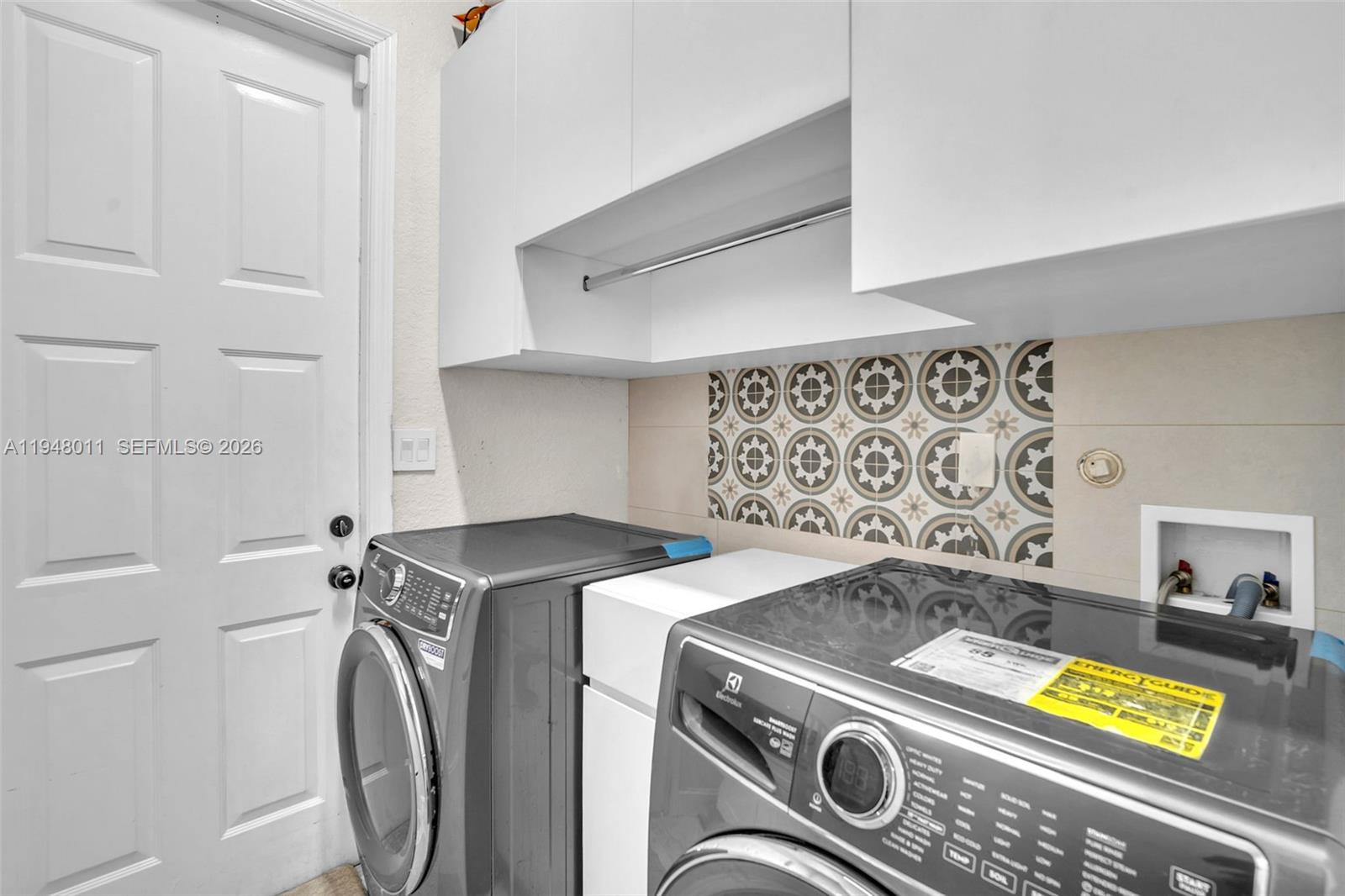 3586 Southwest 143rd Avenue Miramar, FL 33027 - Photo 27 of 51 a utility room with dryer and washer