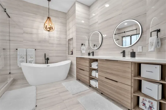 a white bath tub sitting next to a white toilet