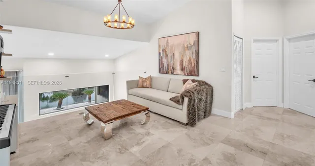 a bedroom with a large bed and a large window