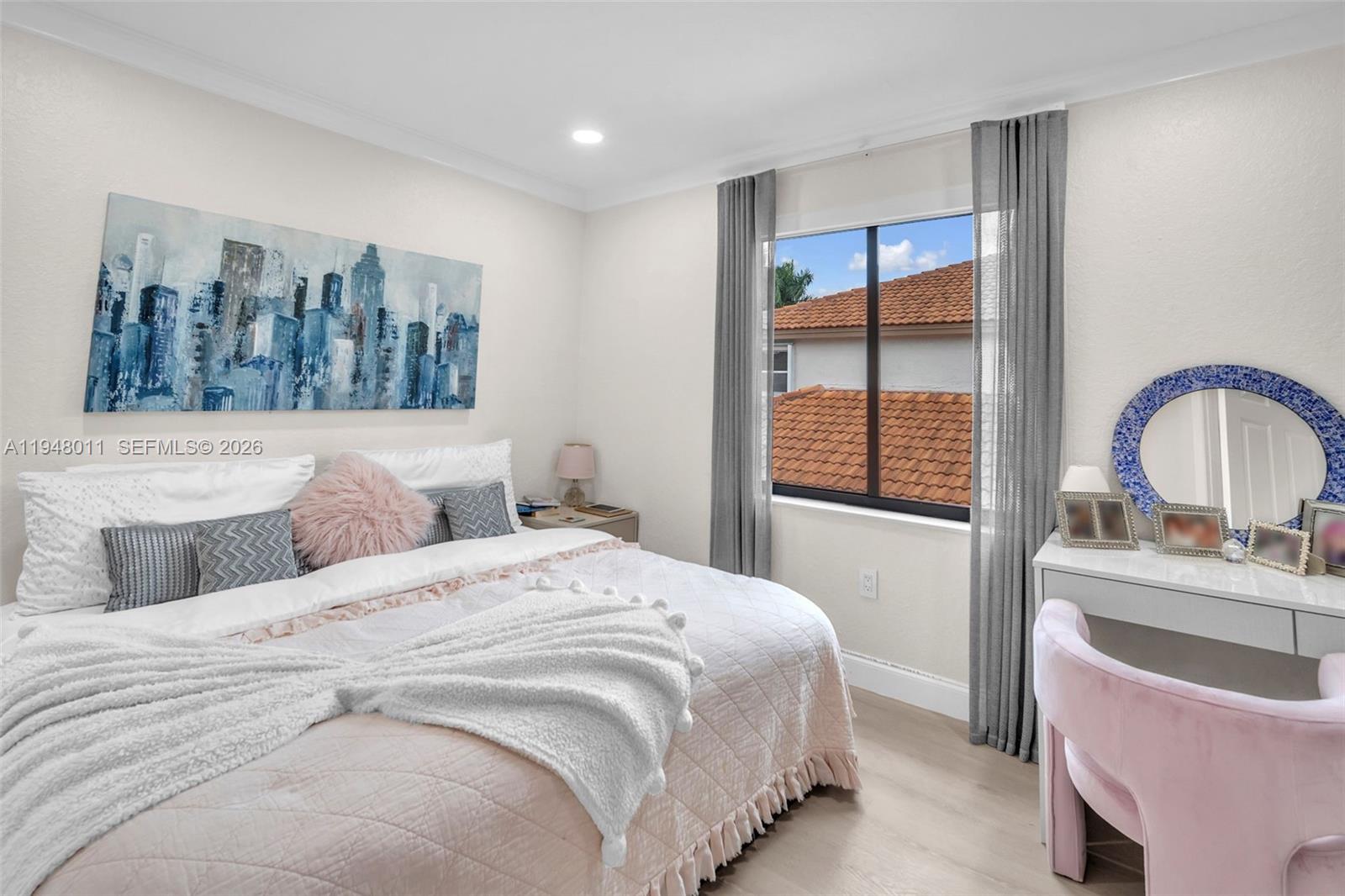 3586 Southwest 143rd Avenue Miramar, FL 33027 - Photo 35 of 51 a bedroom with a large bed and a window