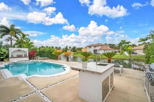 a view of a patio with a table and chairs