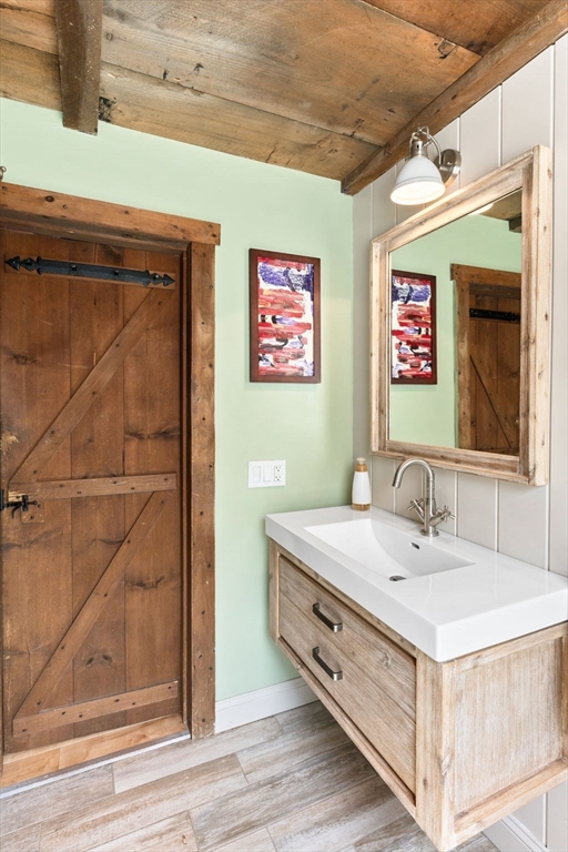 1020 Old Falmouth Road Barnstable, MA 02632 - Photo 29 of 42 a bathroom with a sink and a mirror