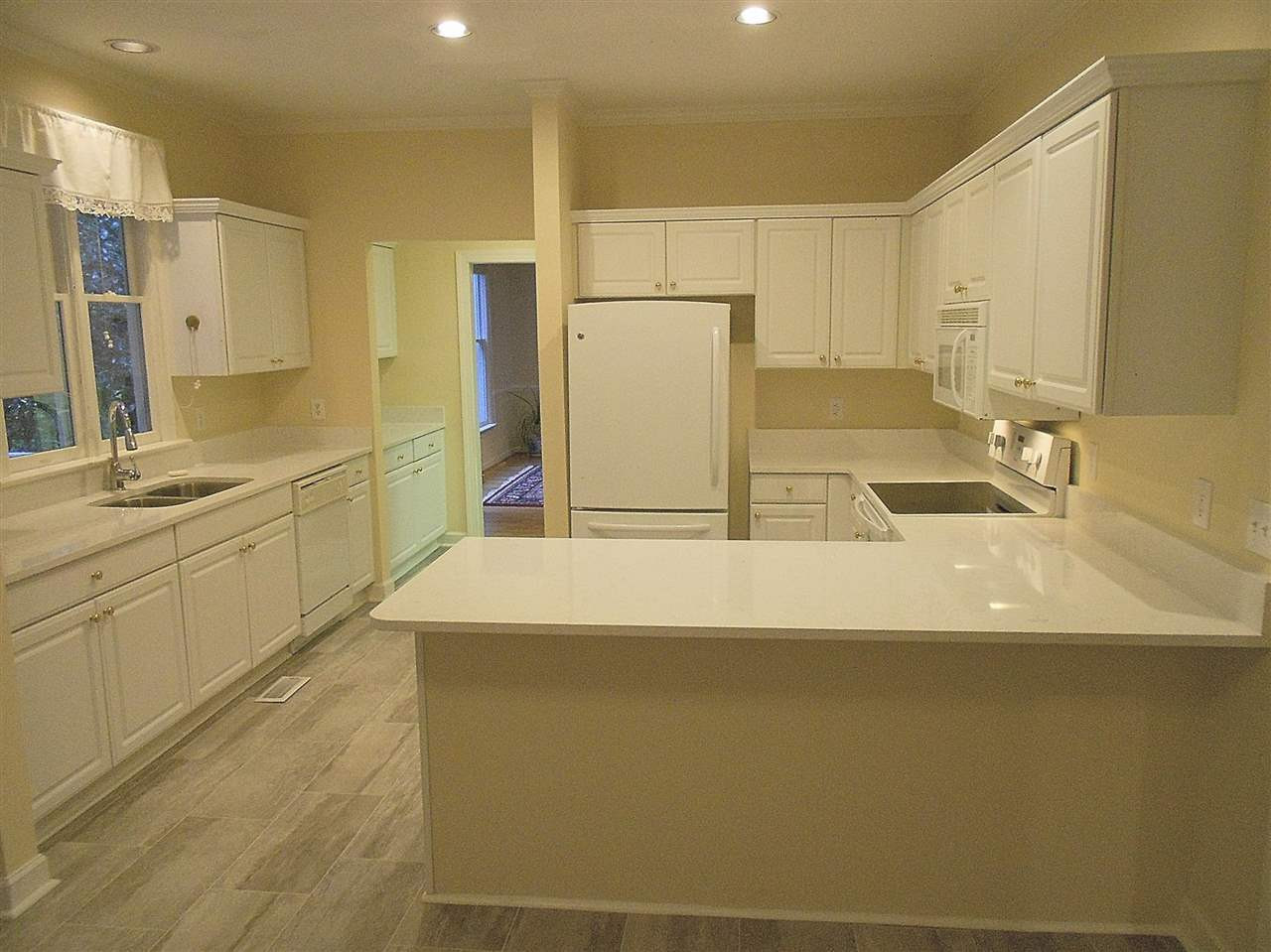 3701 Holly Lane, Unit 201 Raleigh, NC 27612 - Photo 17 of 27 ...has gorgeous new quartz counters, new stone-look flooring, and... Kitchen