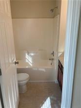4332 Park Gate Way, Unit 175 Atlanta, GA 30344 - Photo 8 of 12 a bathroom with a granite countertop shower and a toilet