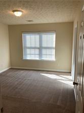 4332 Park Gate Way, Unit 175 Atlanta, GA 30344 - Photo 10 of 12 an empty room with a window