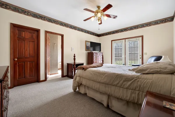 a bed room with bed and window