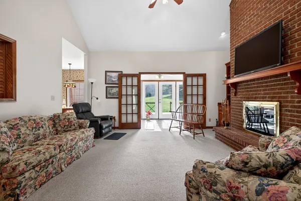 a living room with furniture and a fireplace