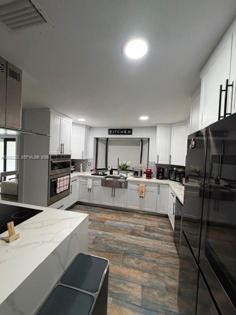 20465 Southwest 200th Street Miami, FL 33187 - Photo 15 of 36 a large white kitchen with lots of counter top space